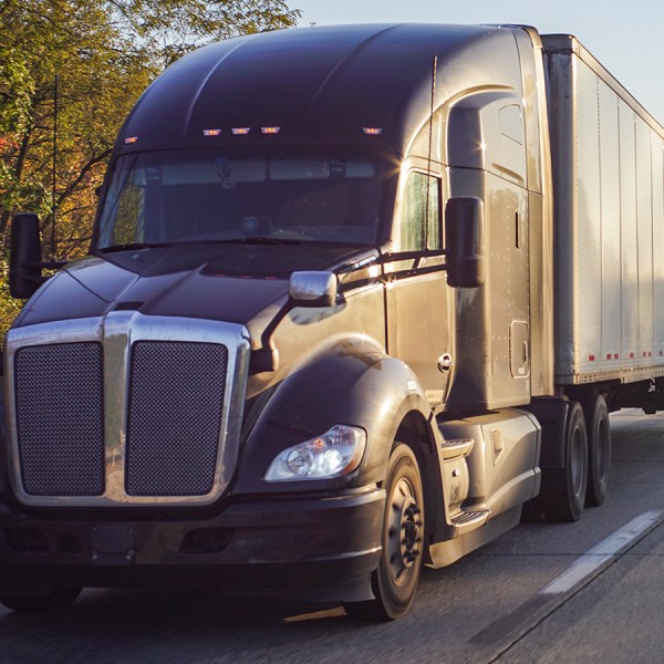 1200x900GMB-4 semi truck driving down the road